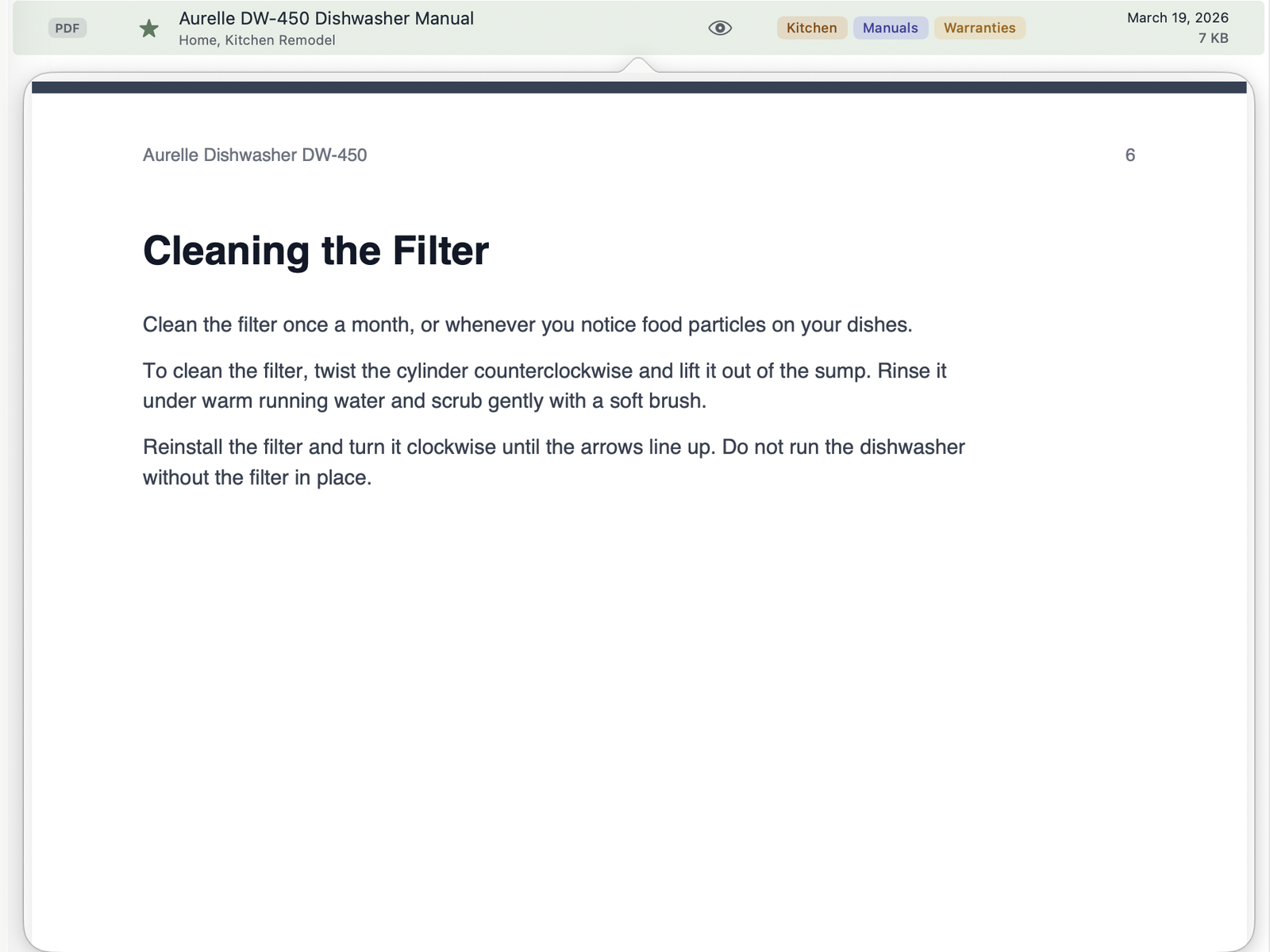 Peek showing the dishwasher manual open to the Cleaning the Filter page that matched a search